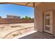 Back patio and backyard framed by a privacy wall at 16783 W Taylor St, Goodyear, AZ 85338