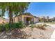 Lovely single-story home showcasing a well-manicured front yard and a two-car garage at 16783 W Taylor St, Goodyear, AZ 85338
