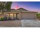Charming single-story home featuring a well-maintained front yard and a two-car garage at 16783 W Taylor St, Goodyear, AZ 85338