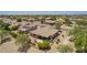 Aerial view of a home featuring a covered patio and desert landscaping in a golf community at 17359 W Calistoga Dr, Surprise, AZ 85387