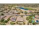 Community aerial view showcasing lush golf course, lake, and well-maintained homes at 17359 W Calistoga Dr, Surprise, AZ 85387