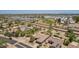 Expansive aerial view of desert home community with golf course and desert landscaping at 17359 W Calistoga Dr, Surprise, AZ 85387