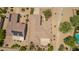 Overhead view of homes featuring tile roofs, desert landscaping, and backyard patio spaces at 17359 W Calistoga Dr, Surprise, AZ 85387