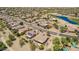 Community aerial view showcasing lush golf course, lake, and well-maintained homes at 17359 W Calistoga Dr, Surprise, AZ 85387