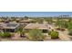Panoramic aerial shot of a desert home near golf course and community with palm trees at 17359 W Calistoga Dr, Surprise, AZ 85387