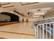 Spacious auditorium with hardwood flooring, stage, and comfortable seating, perfect for events and performances at 17359 W Calistoga Dr, Surprise, AZ 85387