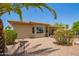 Backyard featuring desert landscaping and a covered patio at 17359 W Calistoga Dr, Surprise, AZ 85387
