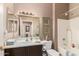 Bathroom boasting a bathtub, vanity with sink, and well-lit mirror at 17359 W Calistoga Dr, Surprise, AZ 85387