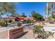 Charming community center with well-maintained landscaping, shaded seating, and inviting signage, enhancing the neighborhood appeal at 17359 W Calistoga Dr, Surprise, AZ 85387