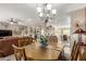 Open-concept dining area showcasing stylish furnishings and seamless flow into the living spaces at 17359 W Calistoga Dr, Surprise, AZ 85387