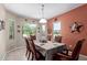 Elegant dining room with decorative accents, a large window, and comfortable seating at 17359 W Calistoga Dr, Surprise, AZ 85387