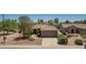 Well-maintained single-story home with a tile roof, low-maintenance landscaping, and a spacious driveway at 17359 W Calistoga Dr, Surprise, AZ 85387