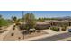 Charming single-story home with well-manicured landscaping and a two-car garage at 17359 W Calistoga Dr, Surprise, AZ 85387