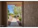 Inviting front entrance with a walkway and landscaped yard view, creating a warm and welcoming arrival at 17359 W Calistoga Dr, Surprise, AZ 85387