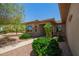 Lovely front entrance featuring desert landscaping with healthy plants and an inviting pathway at 17359 W Calistoga Dr, Surprise, AZ 85387