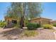 Attractive front exterior featuring manicured desert landscaping and a two-car garage at 17359 W Calistoga Dr, Surprise, AZ 85387