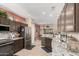 Spacious kitchen with granite countertops, stainless steel appliances, and stylish cabinetry at 17359 W Calistoga Dr, Surprise, AZ 85387