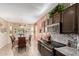 Open kitchen featuring granite counters, modern appliances, and a view of the adjacent breakfast nook at 17359 W Calistoga Dr, Surprise, AZ 85387