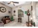 Well-decorated living area featuring rustic elements, comfortable seating, and natural light from the nearby window at 17359 W Calistoga Dr, Surprise, AZ 85387