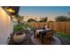 Cozy backyard patio with outdoor dining set, stylish decor, and a tranquil ambiance at 1818 W Highland Ave, Phoenix, AZ 85015