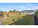Expansive backyard featuring lush green lawn and mature trees at 1818 W Highland Ave, Phoenix, AZ 85015