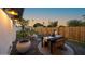 Inviting backyard patio with outdoor seating and a lush green lawn at 1818 W Highland Ave, Phoenix, AZ 85015