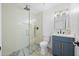 Bathroom with a stunning glass enclosed tiled shower and stylish vanity at 1818 W Highland Ave, Phoenix, AZ 85015