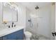Bathroom with a stunning glass enclosed tiled shower and stylish vanity at 1818 W Highland Ave, Phoenix, AZ 85015