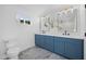 Stylish bathroom features double sinks, a large mirror, and modern lighting at 1818 W Highland Ave, Phoenix, AZ 85015