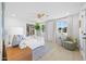 Bright bedroom features hardwood floors, neutral decor, and natural light at 1818 W Highland Ave, Phoenix, AZ 85015