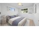 Bright bedroom featuring natural light, a cozy bed, and neutral decor at 1818 W Highland Ave, Phoenix, AZ 85015