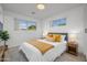 Inviting bedroom with ample natural light, hardwood floors, and stylish accents at 1818 W Highland Ave, Phoenix, AZ 85015