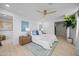 Well-lit bedroom with neutral decor, hardwood floors, and ample closet space at 1818 W Highland Ave, Phoenix, AZ 85015
