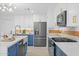 Modern kitchen boasts white cabinets, stainless steel appliances, and a farmhouse sink at 1818 W Highland Ave, Phoenix, AZ 85015
