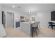 Bright, open kitchen featuring a spacious island with seating and stainless steel appliances at 1818 W Highland Ave, Phoenix, AZ 85015