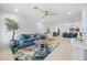 Bright living room featuring a comfortable blue sofa, stylish rug, and open concept design at 1818 W Highland Ave, Phoenix, AZ 85015