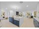 Open concept living space with kitchen island, stainless steel appliances, and inviting living area at 1818 W Highland Ave, Phoenix, AZ 85015