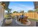 Outdoor patio with brick flooring, dining table and view of the backyard at 1818 W Highland Ave, Phoenix, AZ 85015