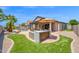 Spacious backyard with outdoor kitchen, patio, pergola, and pool, perfect for entertaining and outdoor enjoyment at 18455 W San Carlos Dr, Goodyear, AZ 85338