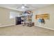 This bedroom features a unique loft bed, ample storage with a dresser, and shelving at 1923 N Cocoa Ct, Casa Grande, AZ 85122