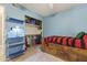 Bright bedroom with built-in shelves and a bed frame with storage at 1927 E Hampton Ave # 204, Mesa, AZ 85204