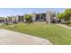 Well-maintained courtyard with a large grassy area, picnic tables and BBQ grill at 1927 E Hampton Ave # 204, Mesa, AZ 85204