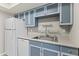Efficient kitchen layout with essential appliances and practical features at 1927 E Hampton Ave # 204, Mesa, AZ 85204