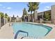 Community pool featuring a sparkling pool with views of multiple apartment buildings at 1927 E Hampton Ave # 204, Mesa, AZ 85204