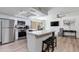 Modern kitchen features stainless appliances, white cabinets, and a large island with seating at 2021 E Osborn Rd # 9, Phoenix, AZ 85016