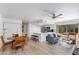 Bright living room featuring wood floors and an open floorplan into the kitchen at 2021 E Osborn Rd # 9, Phoenix, AZ 85016