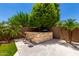Backyard includes stone outdoor kitchen and bar with seating, perfect for dining and entertaining at 20563 W Edgemont Ave, Buckeye, AZ 85396