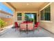 Covered backyard patio with outdoor seating, perfect for relaxation and entertaining with Gathering and friends at 20563 W Edgemont Ave, Buckeye, AZ 85396