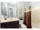 Bathroom showcasing a single vanity, toilet, and shower/tub combo at 20563 W Edgemont Ave, Buckeye, AZ 85396