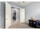 Bedroom with open closet reveals adjacent laundry room area, creating an open, connected atmosphere at 20563 W Edgemont Ave, Buckeye, AZ 85396